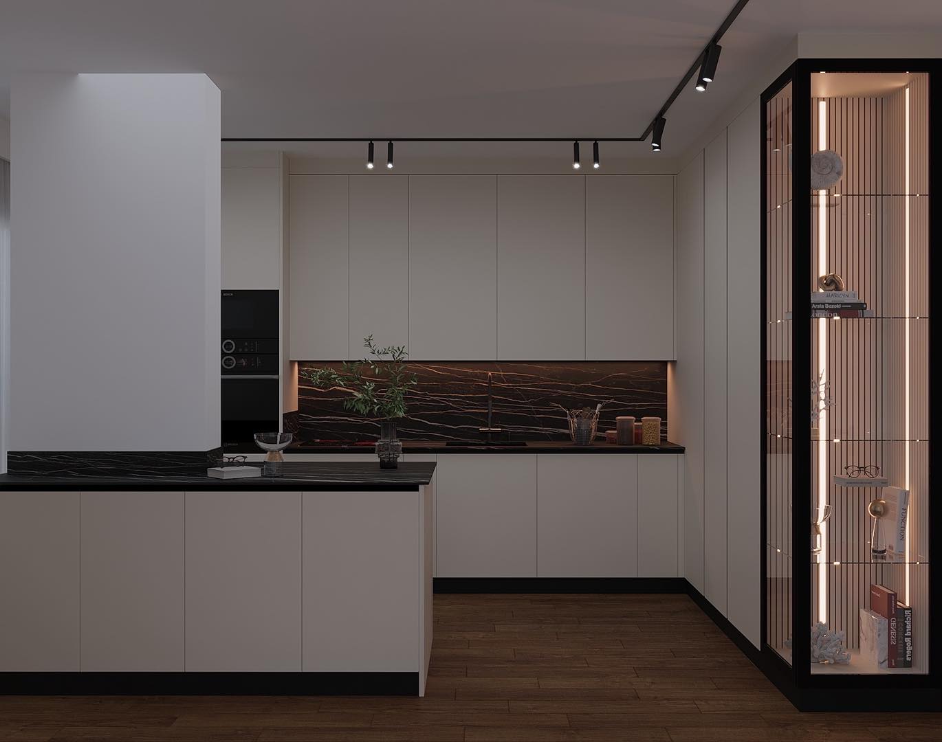 Cuisine moderne avec îlot central et rangements rétro-éclairés